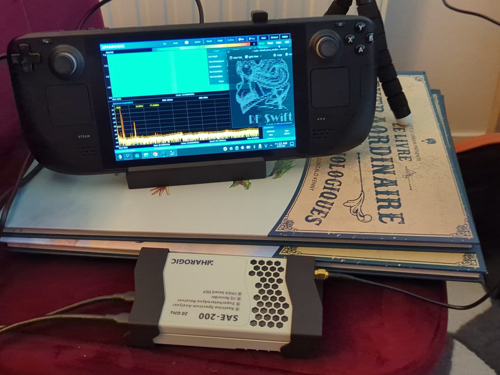 A Steam Deck on a stand running the Harogic SAStudio spectrum display and an RF Swift terminal, connected to a Harogic SAE-200 spectrum analyser.
